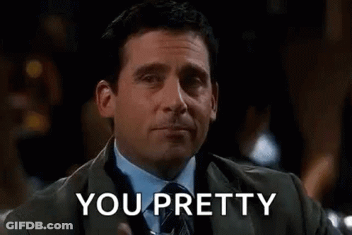 Man In Suit And Tie Holding Drink GIF