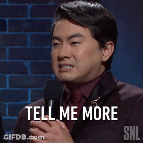 Man In Suit And Tie Holding Microphone GIF