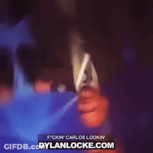 Man In Suit And Tie Holding Microphone With Dylanlocke.com GIF