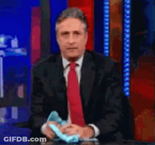 Man In Suit And Tie Holding Paper GIF