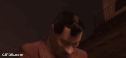 Man In Suit And Tie Holding Red Book GIF
