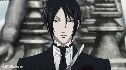 Man In Suit And Tie Holding Scissors GIF