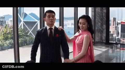 Man In Suit And Tie Holding Woman In Pink Dress GIF