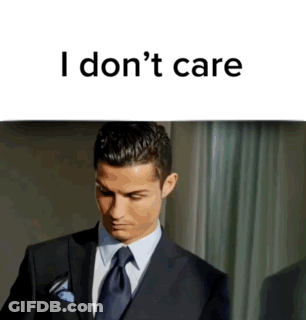 Man In Suit And Tie I Don't Care Sign GIF