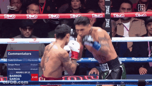 Man In Suit And Tie In Boxing Ring With Red Ring GIF