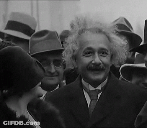 Man In Suit And Tie In Crowd GIF