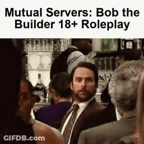 Man In Suit And Tie In Crowd GIF