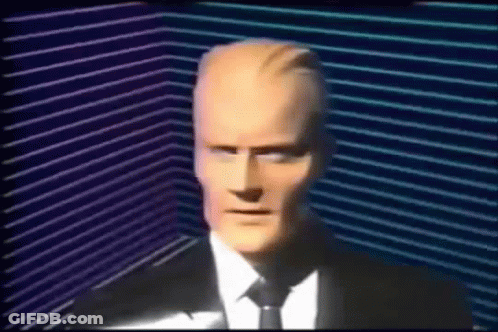 Man In Suit And Tie In Dark Room GIF
