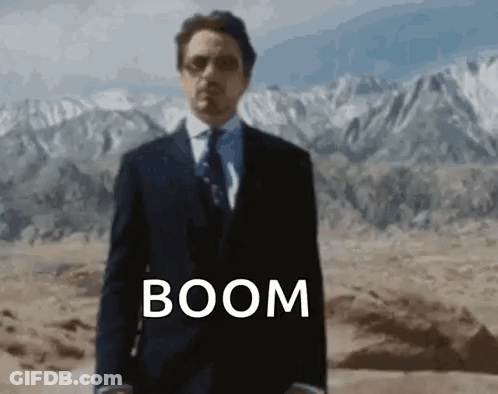 Man In Suit And Tie In Desert With Boom GIF