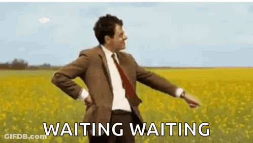 Man In Suit And Tie In Flower Field GIF