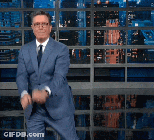 Man In Suit And Tie In Front Of Albert Rif Screen GIF