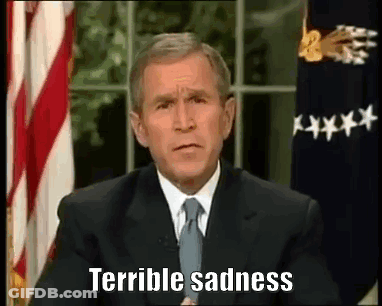 Man In Suit And Tie In Front Of American Flag GIF