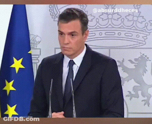 Man In Suit And Tie In Front Of Blue And Yellow Flag GIF