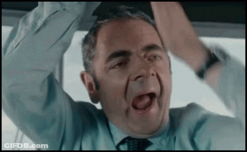 Man In Suit And Tie In Front Of Castle GIF