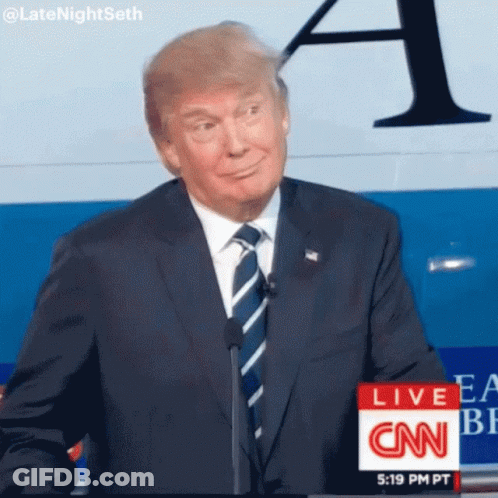 Man In Suit And Tie In Front Of CNN Live Sign GIF