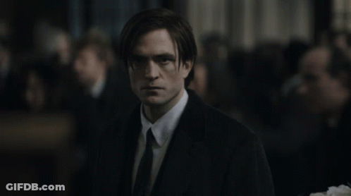 Man In Suit And Tie In Front Of Crowd GIF