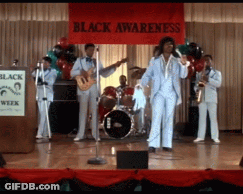 Man In Suit And Tie In Front Of Crowd GIF