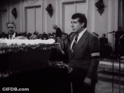 Man In Suit And Tie In Front Of Crowd GIF