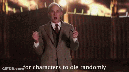 Man In Suit And Tie In Front Of Fire GIF