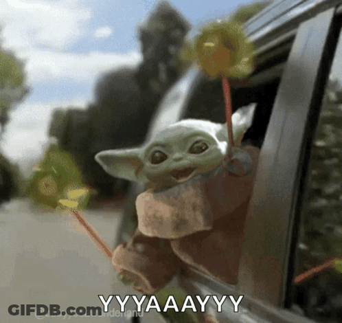 Man In Suit And Tie In Front Of Flowers And Balloons GIF
