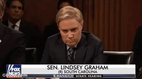 Man In Suit And Tie In Front Of Fox News Banner GIF