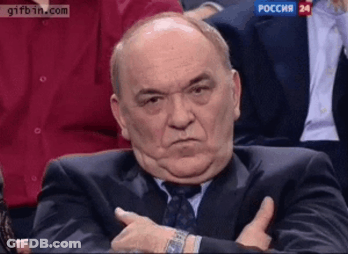 Man In Suit And Tie In Front Of Gifbin Screen GIF
