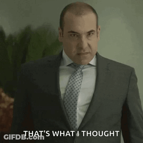 Man In Suit And Tie In Front Of Glass Wall Saying A2B3R GIF