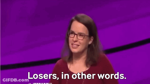 Man In Suit And Tie In Front Of Jeopardy Screen GIF