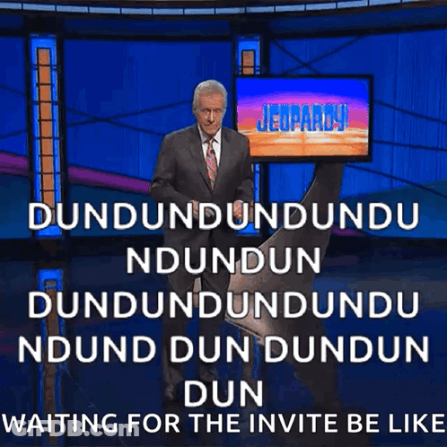 Man In Suit And Tie In Front Of Jeopardy Screen GIF