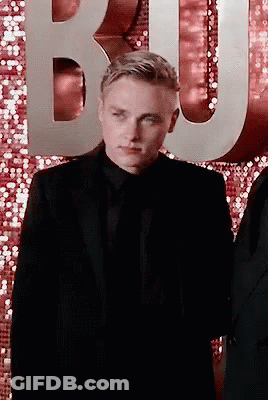 Man In Suit And Tie In Front Of Letter B GIF