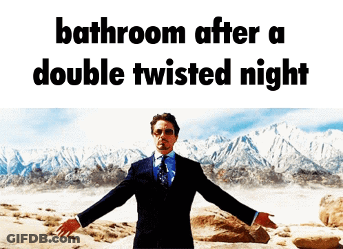 Man In Suit And Tie In Front Of Mountain Saying Bathroom After A Double Twisted Night GIF