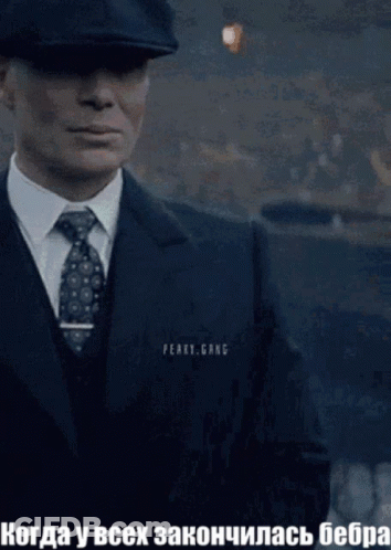 Man In Suit And Tie In Front Of Peary Gang Sign GIF