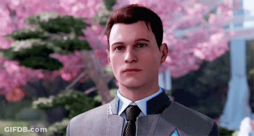 Man In Suit And Tie In Front Of Pink Flower Tree GIF