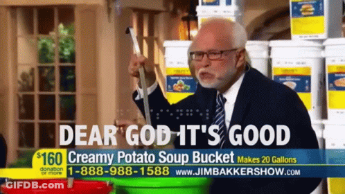Man In Suit And Tie In Front Of Potato Soup Buckets GIF