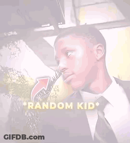 Man In Suit And Tie In Front Of Random Kid Sign GIF