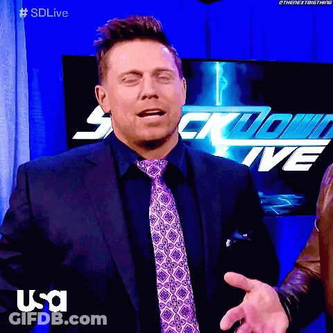 Man In Suit And Tie In Front Of Sdlive Sign GIF