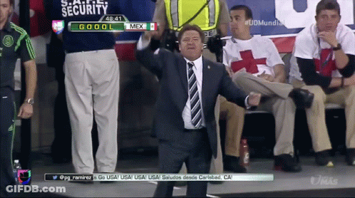 Man In Suit And Tie In Front Of Security Screen GIF
