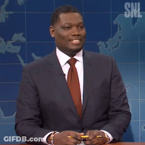 Man In Suit And Tie In Front Of SNL Map GIF
