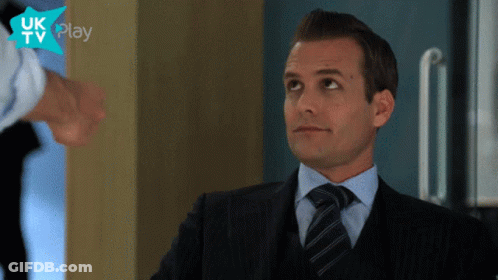 Man In Suit And Tie In Front Of UK TV Play Logo GIF