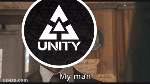 Man In Suit And Tie In Front Of Unity Logo GIF
