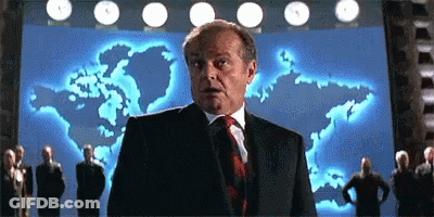 Man In Suit And Tie In Front Of World Map GIF