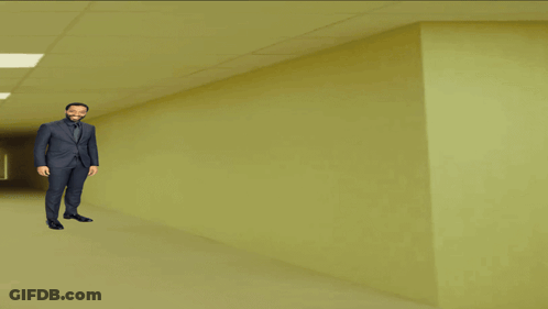 Man In Suit And Tie In Hallway GIF