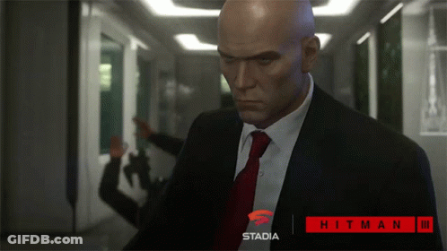 Man In Suit And Tie In Hallway Stadia GIF