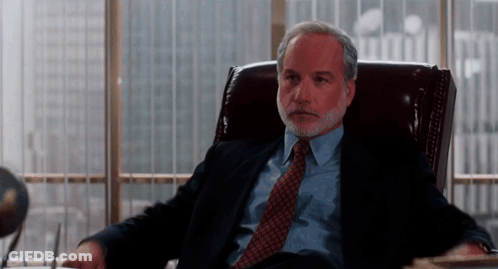 Man In Suit And Tie In Office Chair GIF
