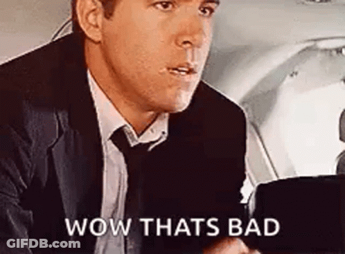 Man In Suit And Tie In Plane Back Seat GIF