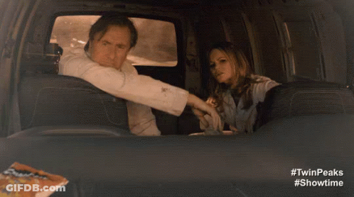 Man In Suit And Tie In Plane Back Seat GIF