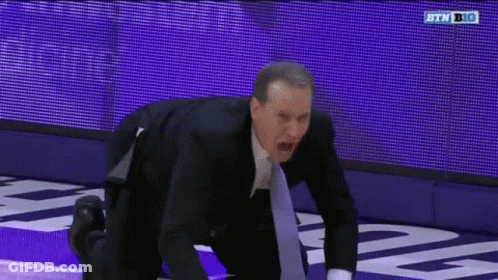 Man In Suit And Tie Kneeling On Purple Court GIF