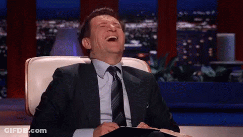 Man In Suit And Tie Laughing GIF