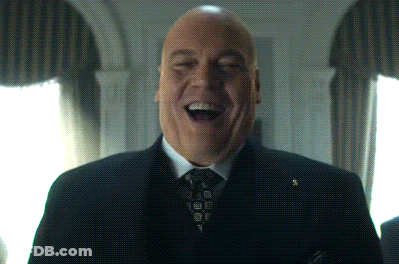 Man In Suit And Tie Laughing GIF