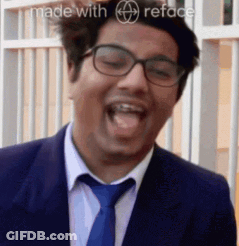 Man In Suit And Tie Laughing GIF